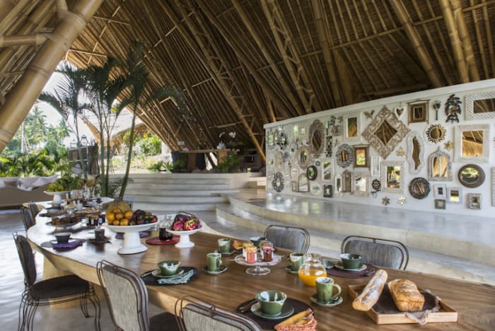 Set table for breakfast in the open living room at Sandat Glamping tents,Ubud